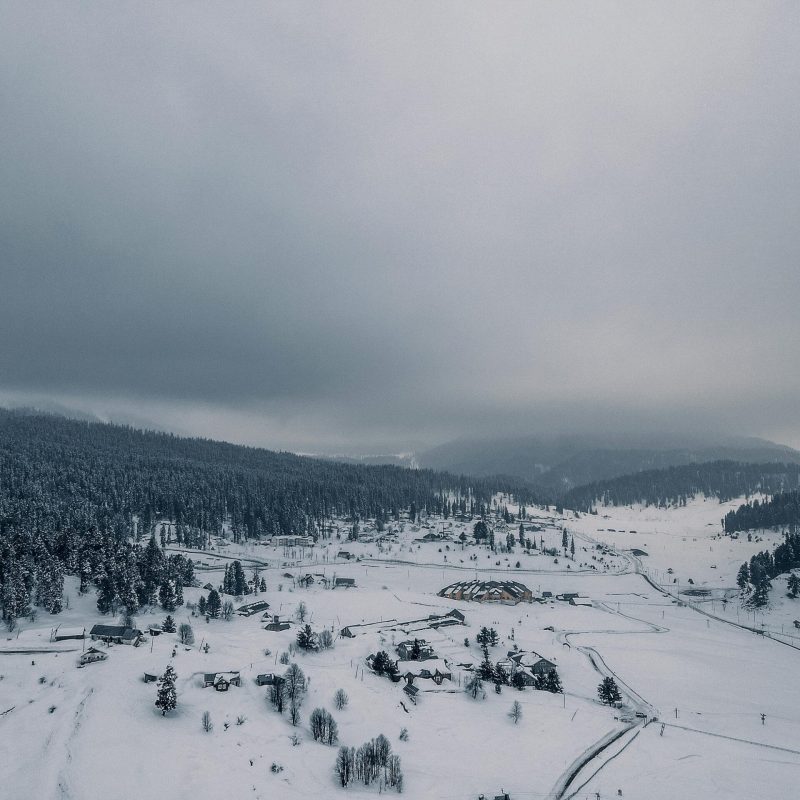 pexels-photo-6729642-6729642 Breathtaking aerial view of Gulmarg's snowy landscape, showcasing serene winter beauty.